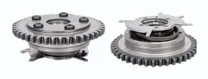 MONTTRON VVT camshaft adjusters: two variable valve timing phasers with their chain sprockets, one seen from the front and one from the back